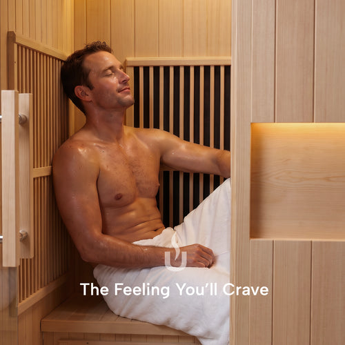 Man relaxing on the bench inside the 1-Person Infrared Hemlock Sauna