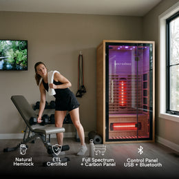 Woman working out next to the 1-Person Full Spectrum Hemlock Sauna, feature icons