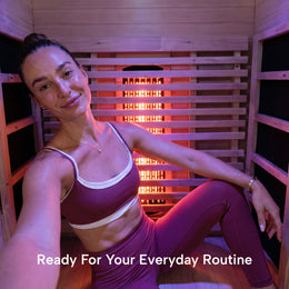 Woman smiling inside the 1-Person Full Spectrum Hemlock Sauna