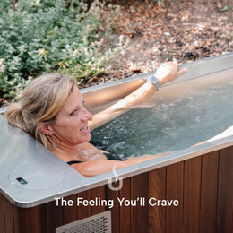 Woman lying back in the 2-Person Cedar Ice Bath with Chiller