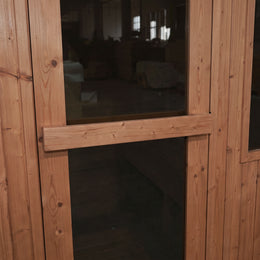 Cedar door of the 4-Person Outdoor Traditional Cedar Sauna
