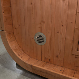 Vent in the curved cedar wall of the 4-Person Outdoor Traditional Cedar Sauna