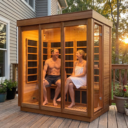 Couple sitting inside the 4-Person Outdoor Infrared Cedar Sauna on a backyard patio