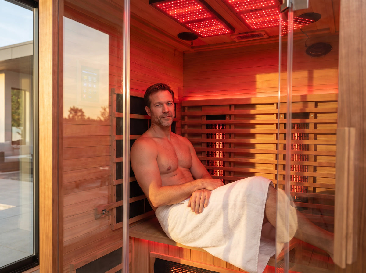 A person sitting inside the infrared sauna cabin