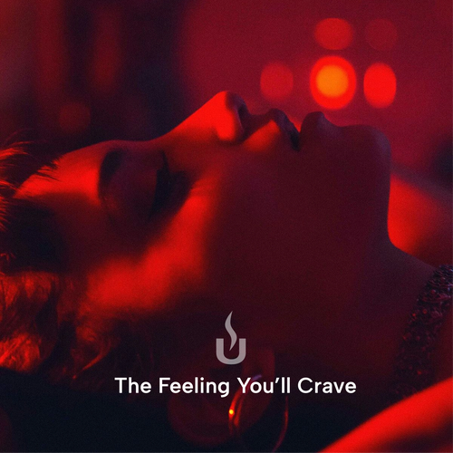 Woman resting in red light inside the 2-Person Red Light + Full Spectrum Cedar Sauna