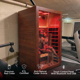 Woman inside the 2-Person Red Light + Full Spectrum Cedar Sauna in a home gym, feature icons