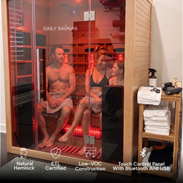Two people inside the 3-Person Red Light + Full Spectrum Hemlock Sauna, feature icons