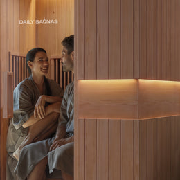 Two women talking inside the 2-Person Infrared Hemlock Sauna