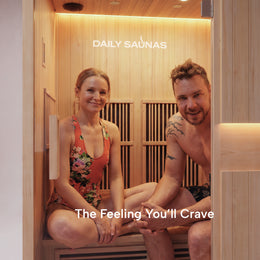 Couple sitting together inside the 2-Person Infrared Hemlock Sauna