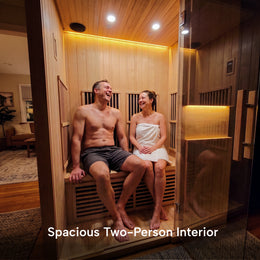 Couple relaxing inside the 2-Person Infrared Hemlock Sauna