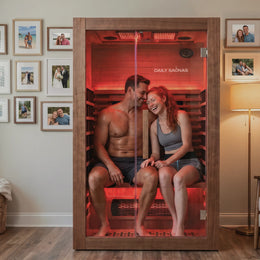Couple sitting inside the 2-Person Red Light + Full Spectrum Cedar Sauna
