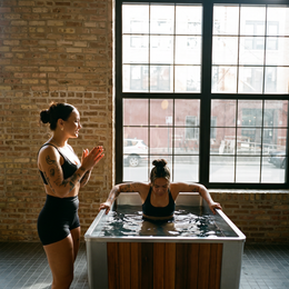 Two women with the 2-Person Cedar Ice Bath with Chiller in a loft